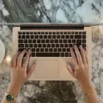 Atendimento Home Office e mais vagas hands holding a laptop